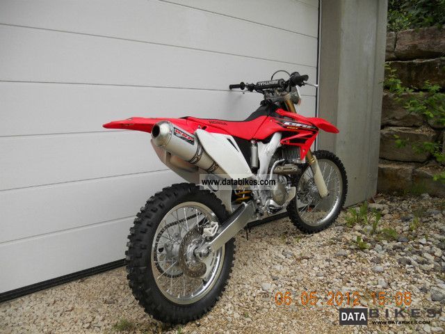 2006 Honda  crf 250 x electric start and a car letter Motorcycle Rally/Cross photo